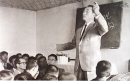 Reverend Moon giving a sermon at Chuncheon Church during a district now