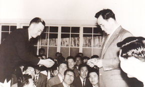 Bo-hi Pak receiving a Holy Paper
