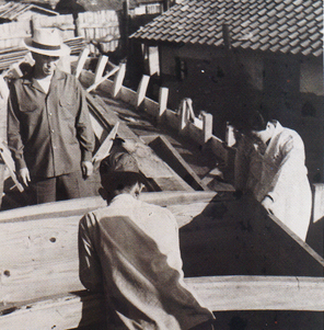 Reverend Moon helping with the construction of the ship Cheonseung-ho