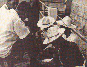 Jong-gu Park polishing shoes in Myong-dong to raise money for building choongju sung hwa academy (spring 1965)